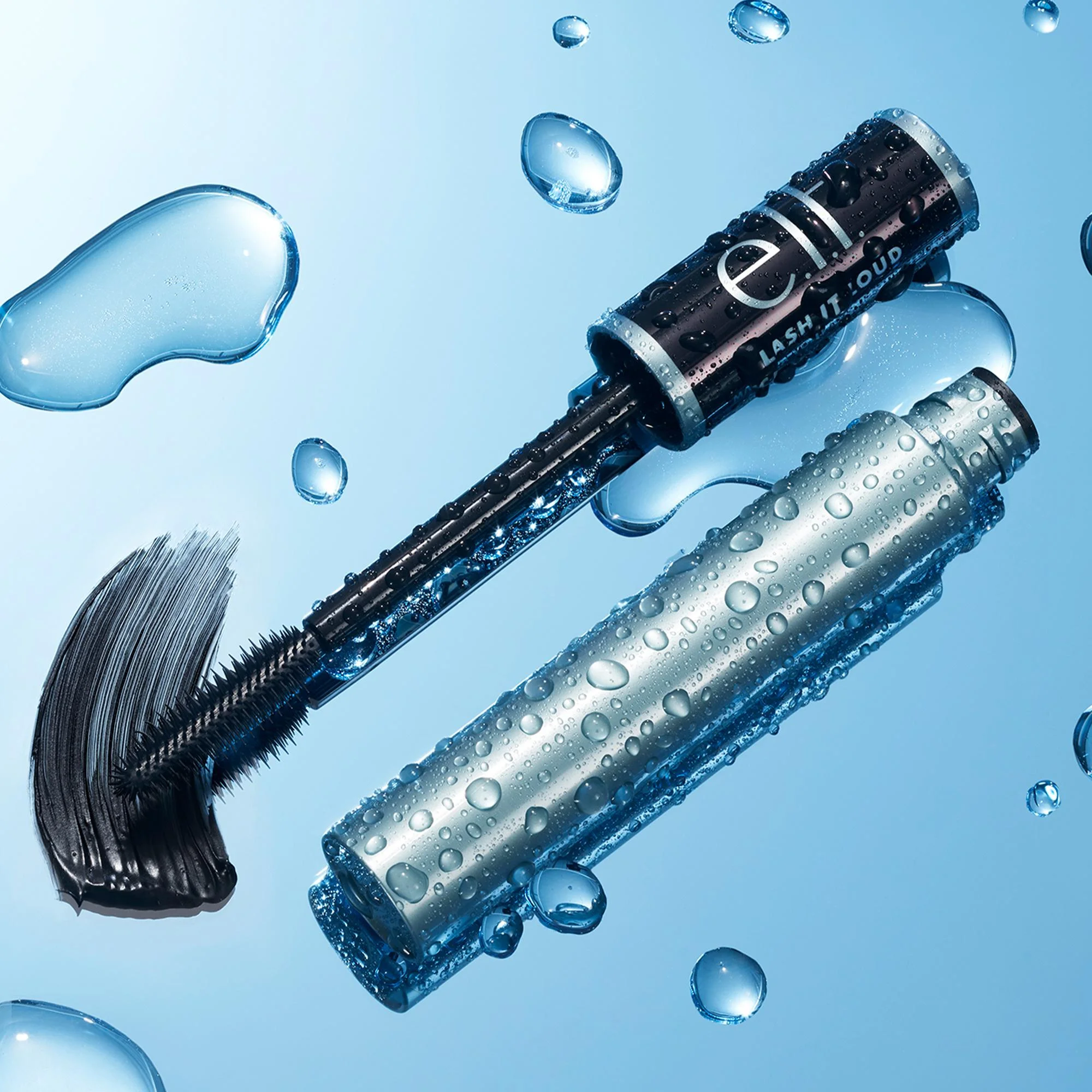 Lash it Loud Mascara with applicator on a blue water droplet background