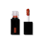 Lip gloss in coral cutie shade with applicator on a white background