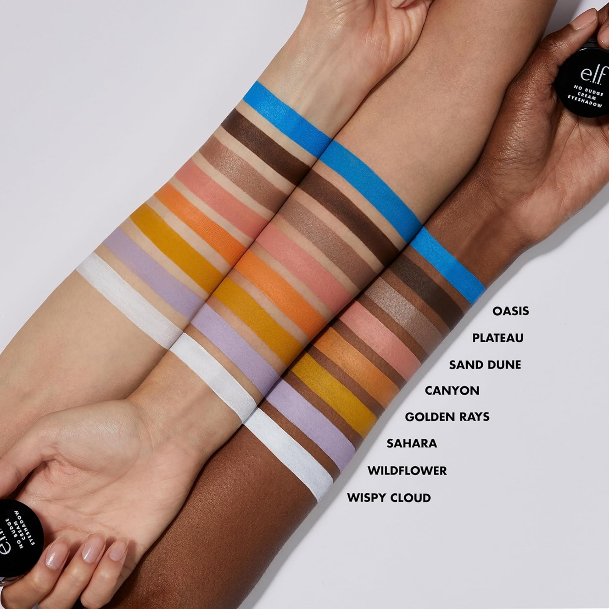 Color swatches on a person's arm with 'elf' makeup product labeled.