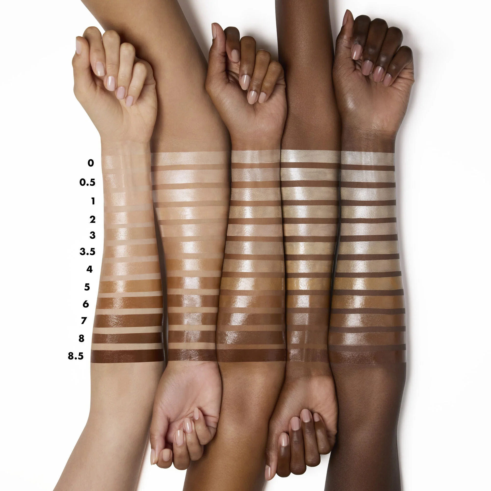 Swatches van e.l.f. Halo Glow Liquid Filter op verschillende huidtinten.