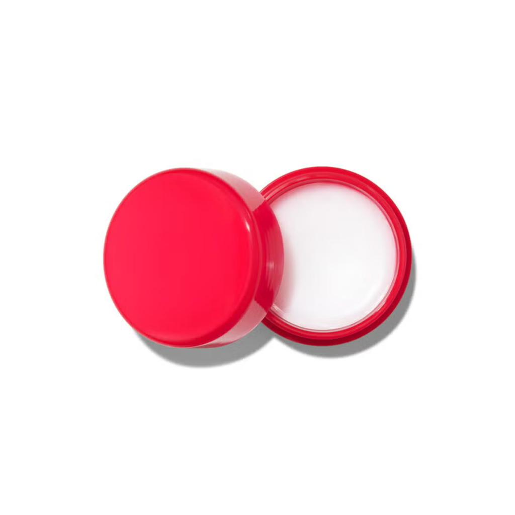 Red container with white cream on a white background