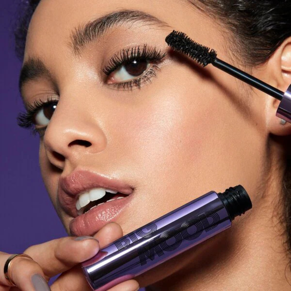 Model applying e.l.f. Big Mood Mascara for volumized lashes black waterproof