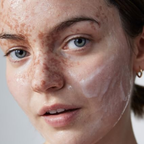 Close-up of a person's face with a neutral background