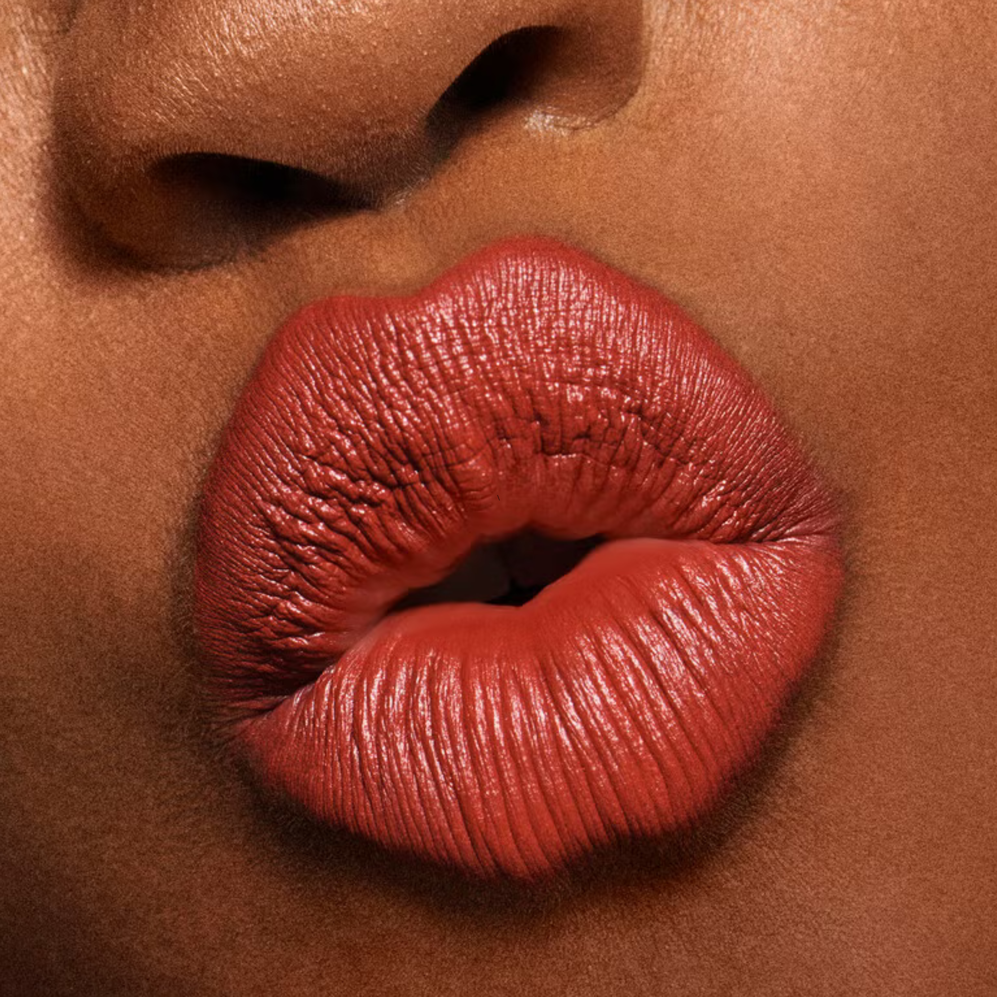 Close-up of a person's lips with a focus on texture and color.