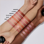 Lipstick swatches on different skin tones with brand name visible