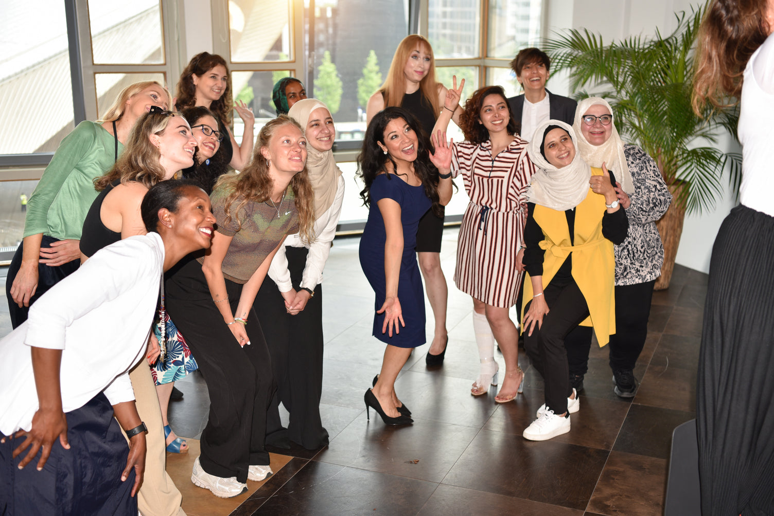 Group of women from diverse backgrounds participating in a She Matters community programme