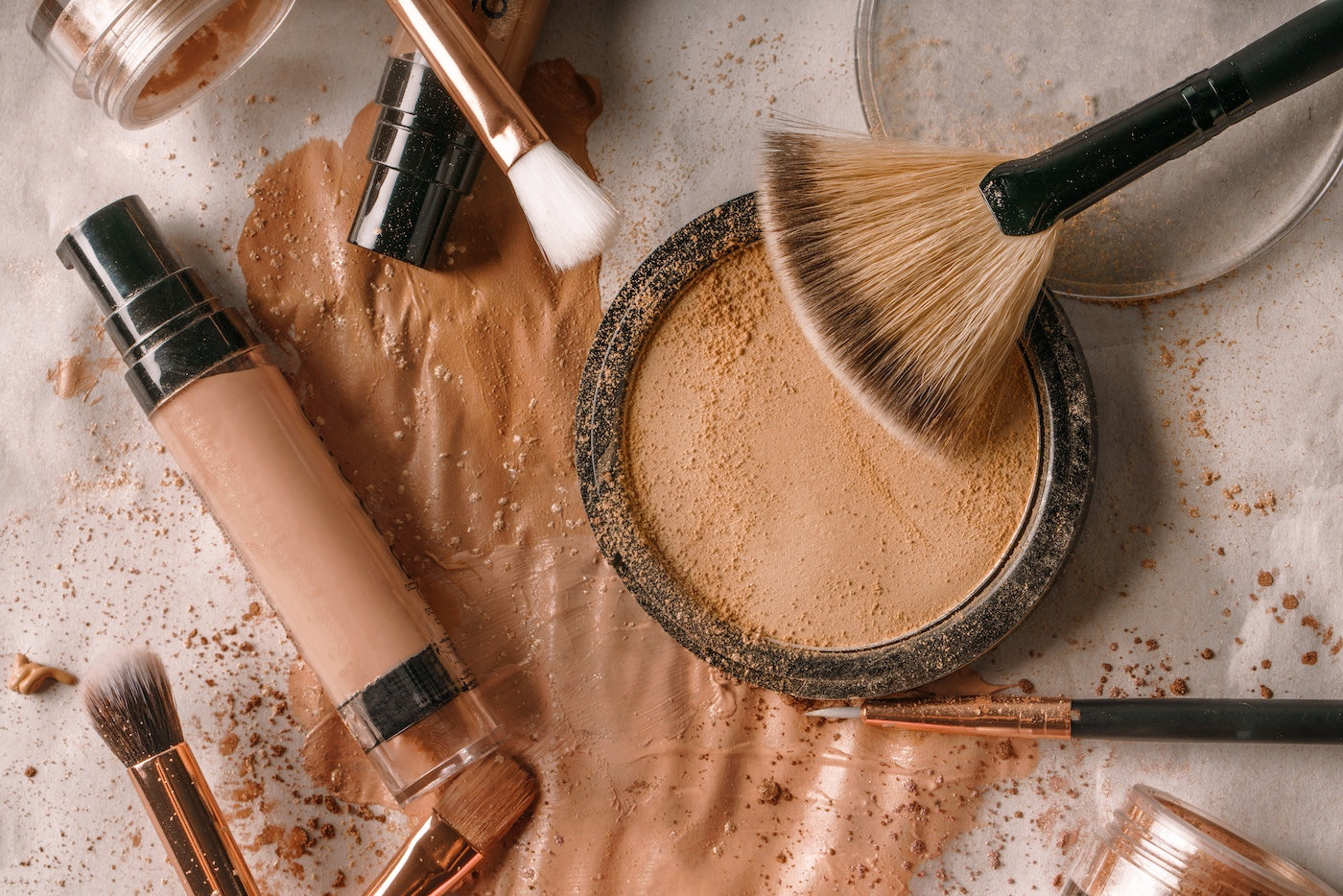 Foundation, powder and makeup brushes from the She Matters Impact Shop
