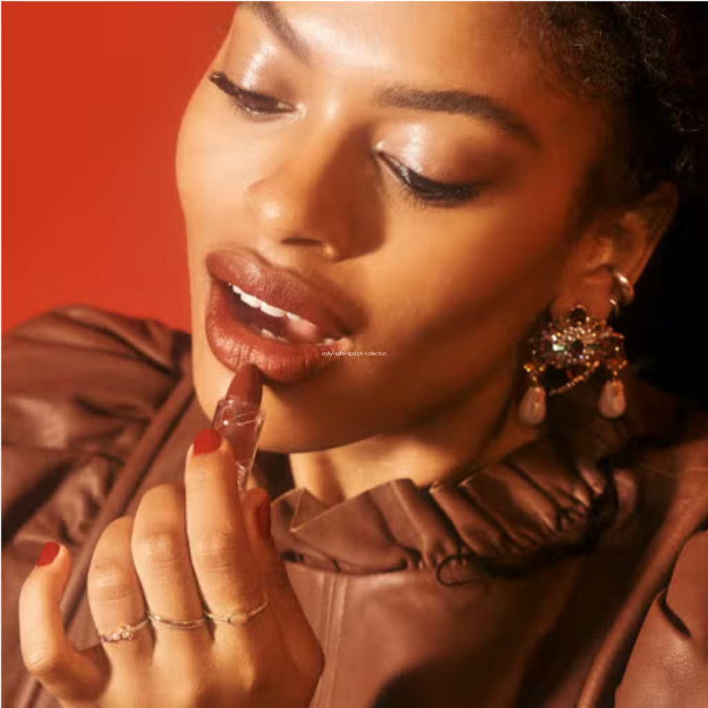 Woman with holding a lipstick against her lips on a red background