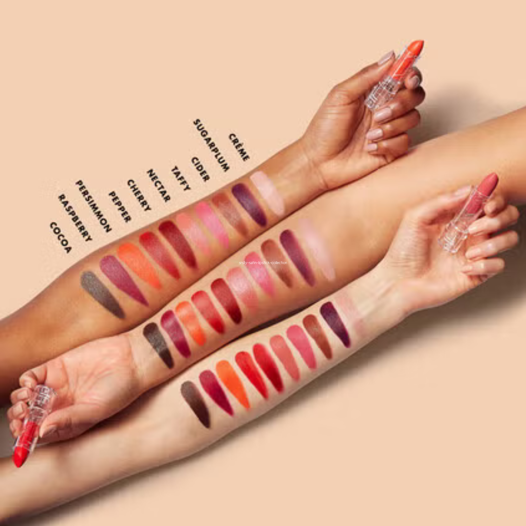 Lipstick swatches on a person's arm with lipstick applicators.